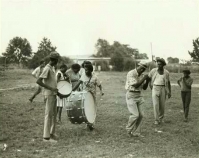 Musicians playing in field From Mississippi Blues history presentation Courtesy of William Ferris
