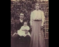 Historic photograph of a husband, wife and baby in front of  a quilt  In upcoming book by Janet E. Finley Schiffer Publishing, Atglen, Pennsylvania; late 2012 Collection of Janet E. Finley
