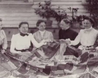 Historic photograph of group of women holding a quilt In upcoming book by Janet E. Finley, Schiffer Publishing, Atglen, Pen nsylvania; late 2012 Collection of Janet E. Finley